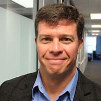 headshot of shawn dinsmore with hallway background