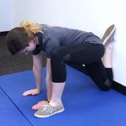 woman stretching quads