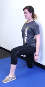 woman stretching quads