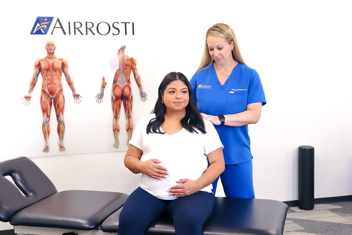 Airrosti doc treating pregnant woman