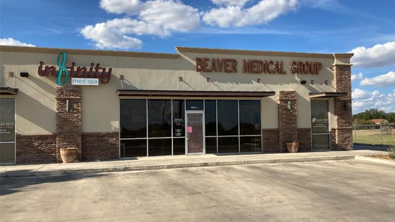 A wide shot of the building at Airrosti Beaver Medical Group. Airrosti's front entrance is on the far right corner of the building, with the Airrosit logo on the glass door.