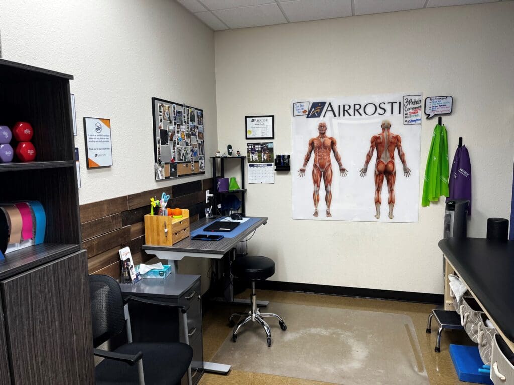 a photo of the recovery room at Airrosti Forney. The MSK diagram posters are displayed on the back wall.