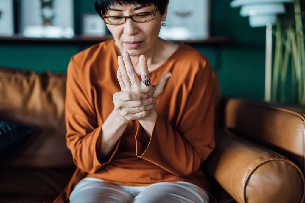 Woman Holding Her Wrist in Pain