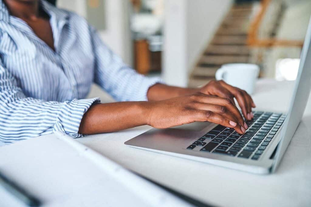 Person Typing on Computer Wrist Pain-Free