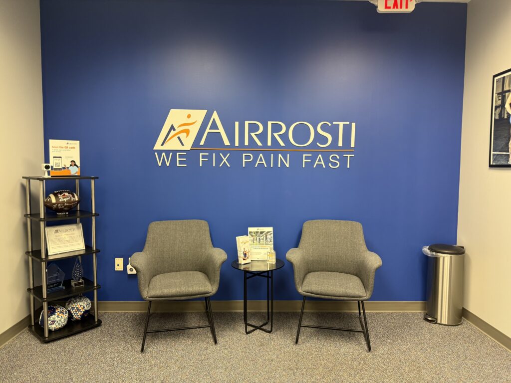 Airrosti Keystone Parke lobby and waiting room with Airrosti branding on the wall