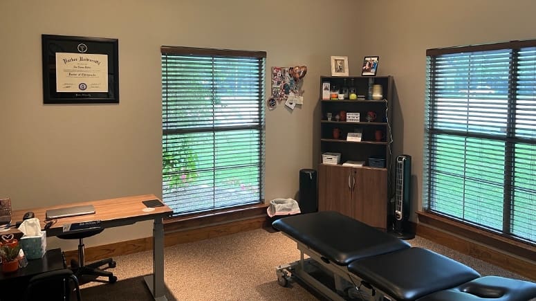 A photo showing the inside treatment room at Airrosti Main Place