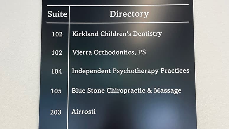 The directory of offices for the building Airrosti Kirkland is located in, showing that Airrosti is in suite 203.