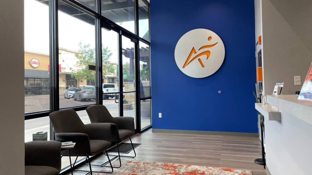 An interior view of the lobby at Airrosti Quarry Village in San Antonio, TX