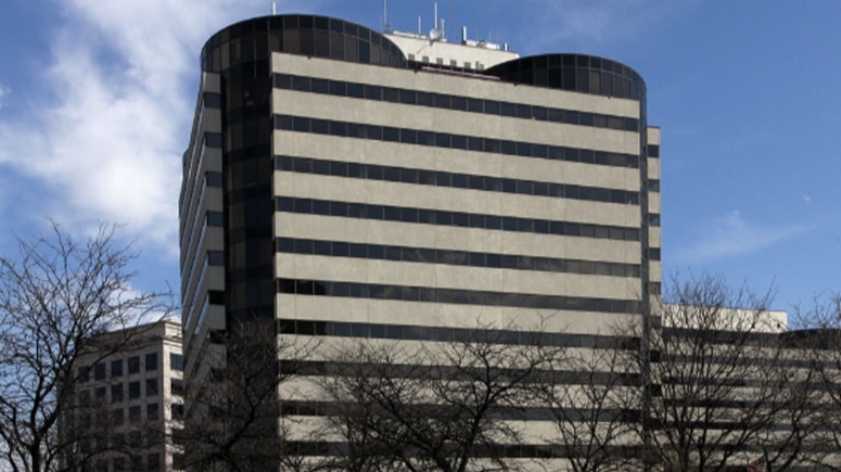 A wide shot exterior view of the building where Airrosti Tyson is located in McLean, Virginia.
