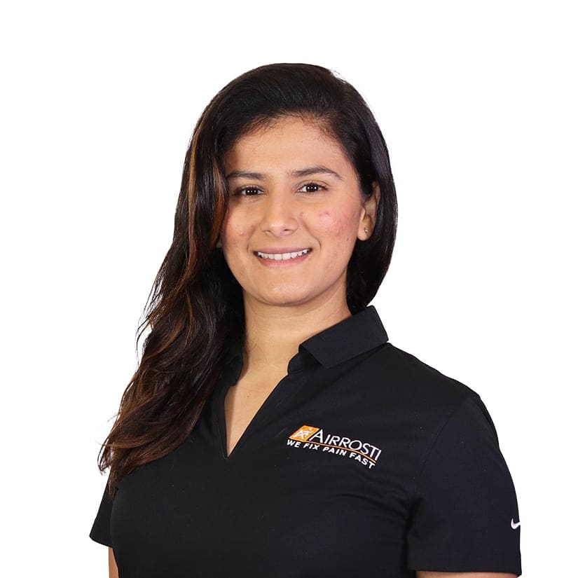 A professional headshot of Dr. Genesis Travez, DC and Airrosti Certified Provider