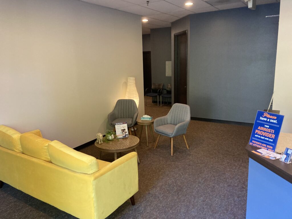 front desk and seating area at Airrosti Smokey Point