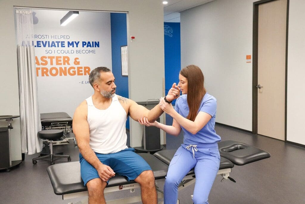 Airrosti Doc Treating Patient
