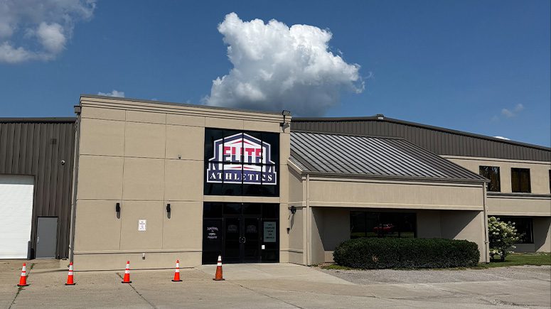 A view of the outside of the Airrosti Elite building. The logo for Elite Athletics can be seen above the door.