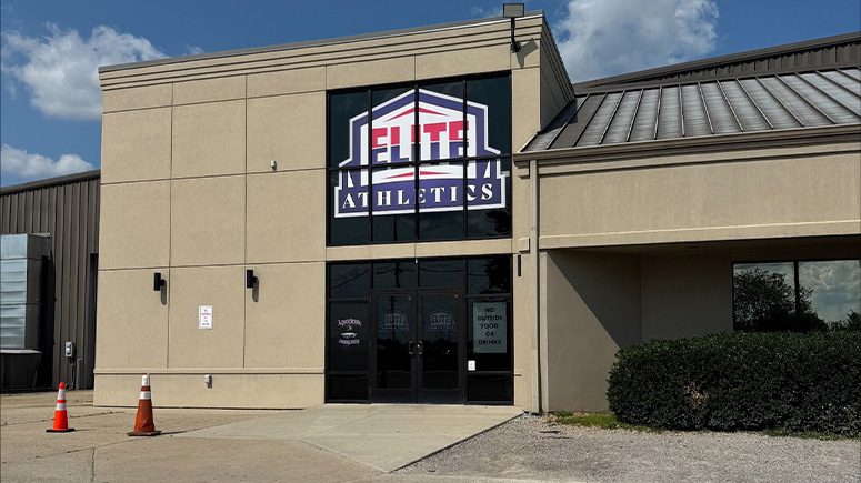 A view of the outside of the Airrosti Elite building. The logo for Elite Athletics can be seen above the door.