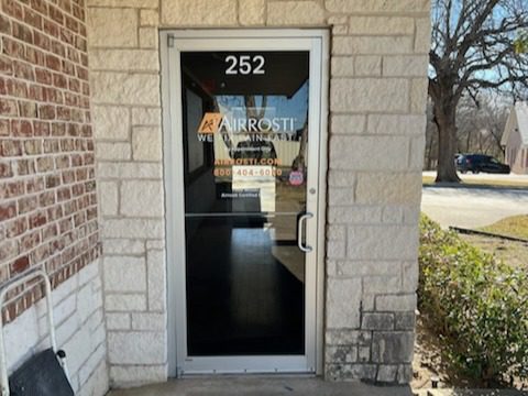 The Exterior door entrance to Airrosti Sherman