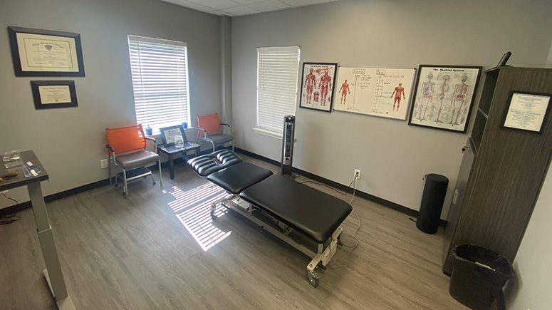 An interior view of the treatment room inside Airrosti Deer Park.